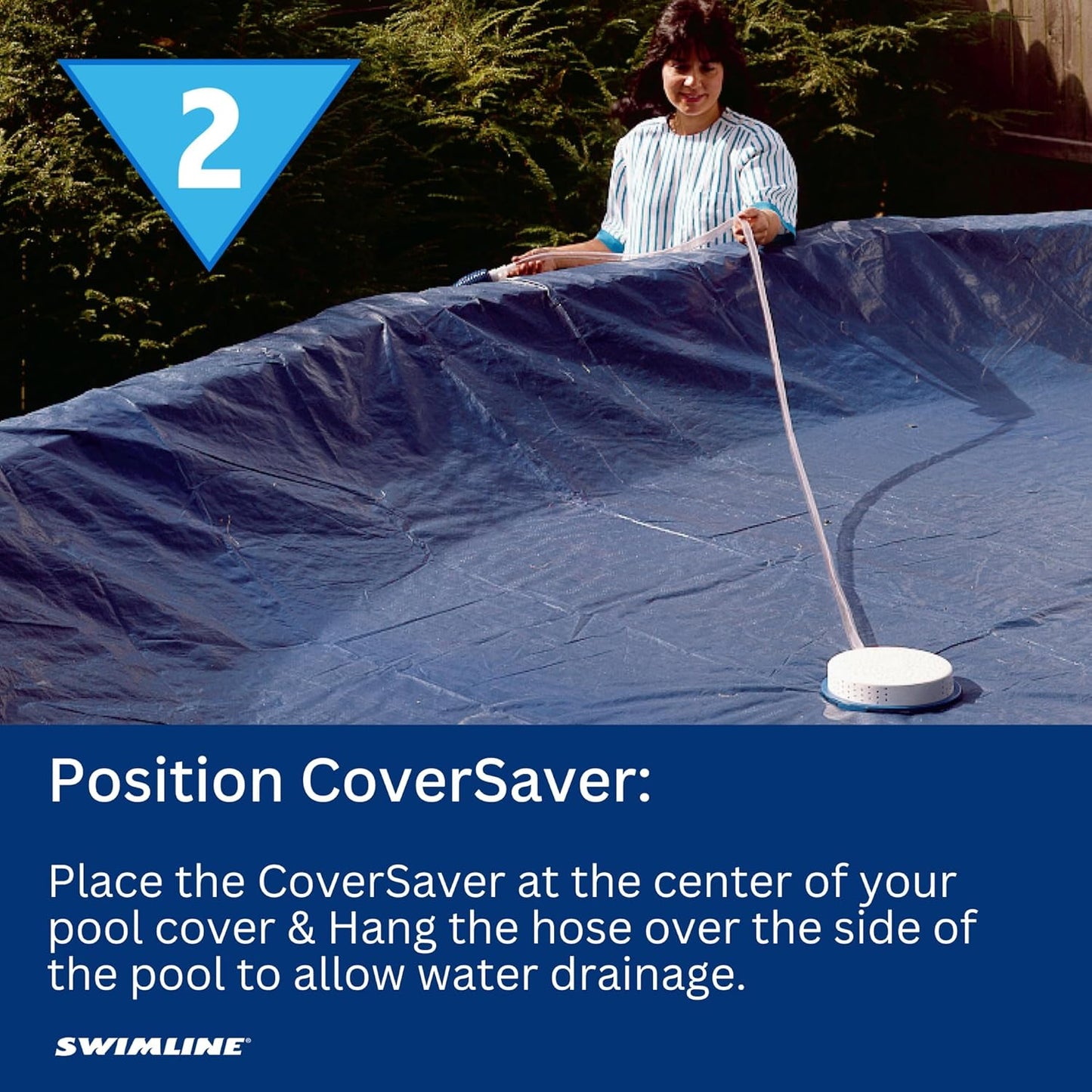A woman places the Swimline Non-Electric Siphon Cover Pump (5436) at the center of a covered pool, using its hose to easily remove water from the pool cover.