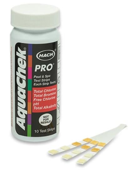 AquaChek Pro 5-in-1 Test Strips (100/Pack | 511710) display three strips before the bottle, highlighting key pool and spa testing parameters: chlorine, bromine, pH, and alkalinity—perfect for precision-needed service professionals.