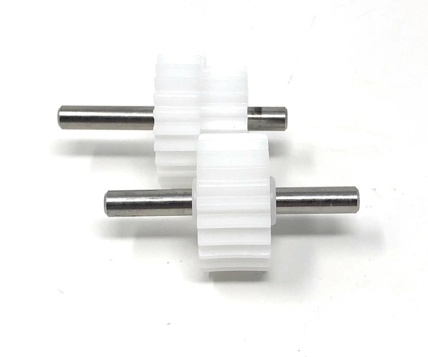Two white plastic gears with metal axles, part of the Pentair Rebel/Warrior Drive Gear Kit (360292) by Pentair, are positioned parallel to each other on a white background.