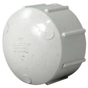 The Pentair Triton II Threaded Cap 1.5" | 154871 is a round white plastic PVC cap with ribbed edges and embossed text, ideal for sealing pipe ends.