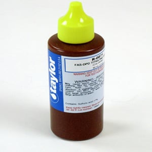 The Taylor FAS-DPD Titrating Reagent for Chlorine is a 2 oz brown bottle with a green cap, labeled "Taylor." This essential molybdenum indicator includes instructions and warnings, making it vital for the upcoming testing season. Pack of 12, R-0871-C-12.