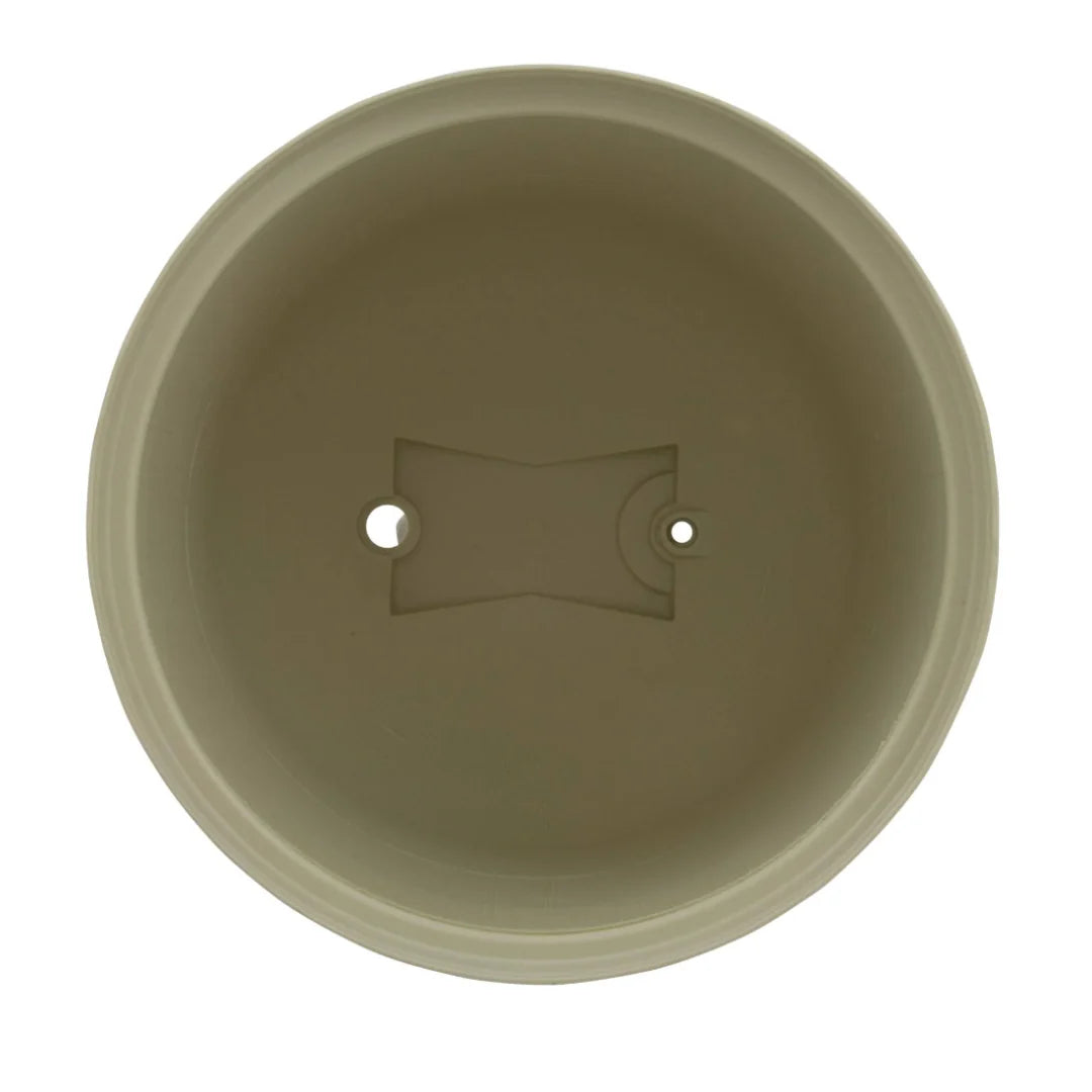 Top view of a round, beige plant pot with a central drainage hole and an additional smaller hole reminiscent of the Pentair Clean & Clear Filter Lid design.