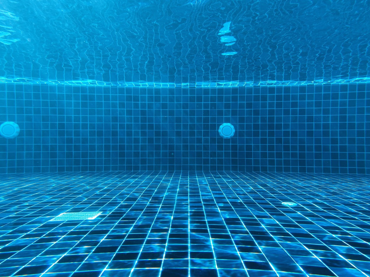 A clear pool using a pool product to keep clean and clear.