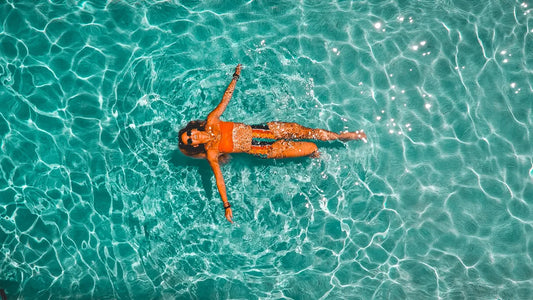 a woman floating in a pool