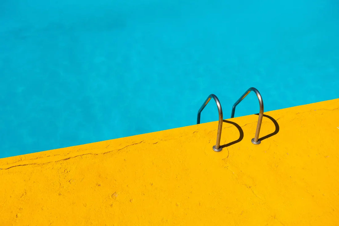 saltwater pool with ladder and yellow platform