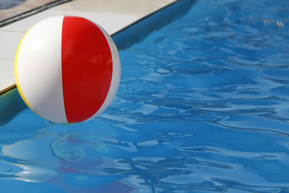 a beach ball floating in a pool