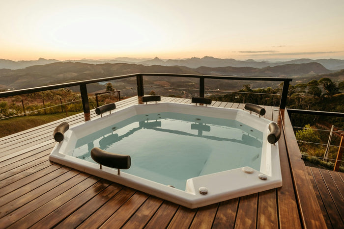 a hot tub overlooking a mountain range