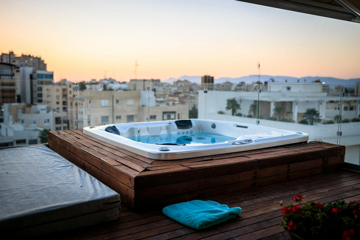 a hot tub overlooking a city