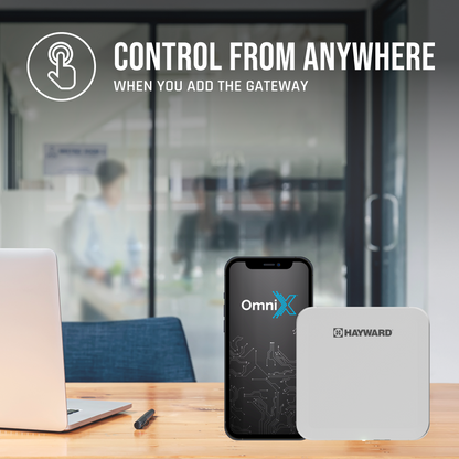 A Pool Goods Super Pump VS 620 with OmniX 2.25 HP and gateway device sit on a desk, showing how easily you can control your variable speed pool pump from anywhere by adding the OmniX Gateway for smart pool automation.