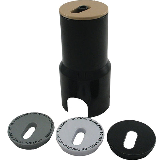 The CMP Adjustable Flow Deck Jet (25597-200-000) by CMP is a black cylindrical object with a beige top, accompanied by three round protective discs and pool installation instructions lying flat nearby.